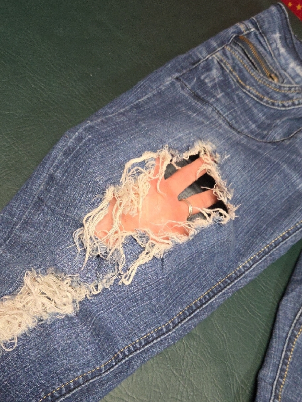 **Women’s Skinny Distressed Blue Jeans with Burgundy Patch Details** - Picture 5 of 11